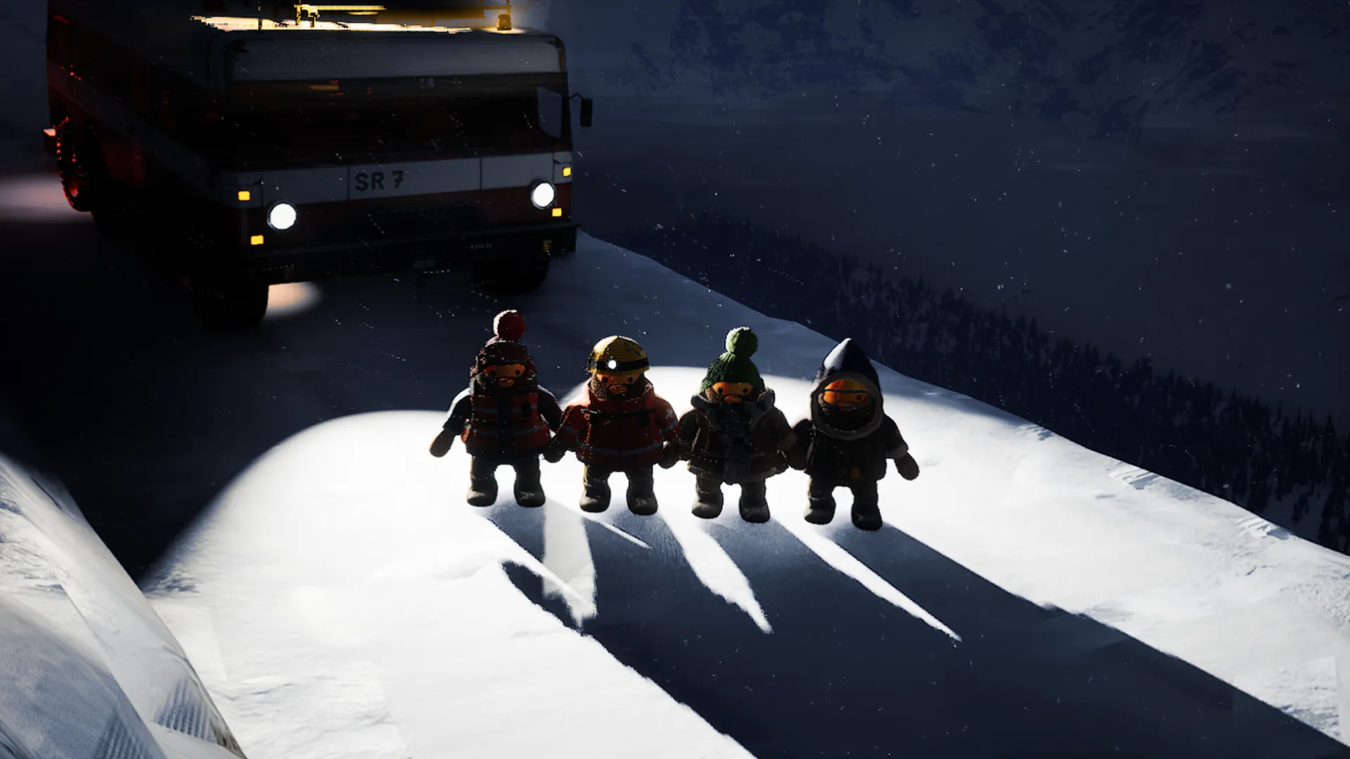 Four felt rescuers stand in the headlights of the rescue van at night