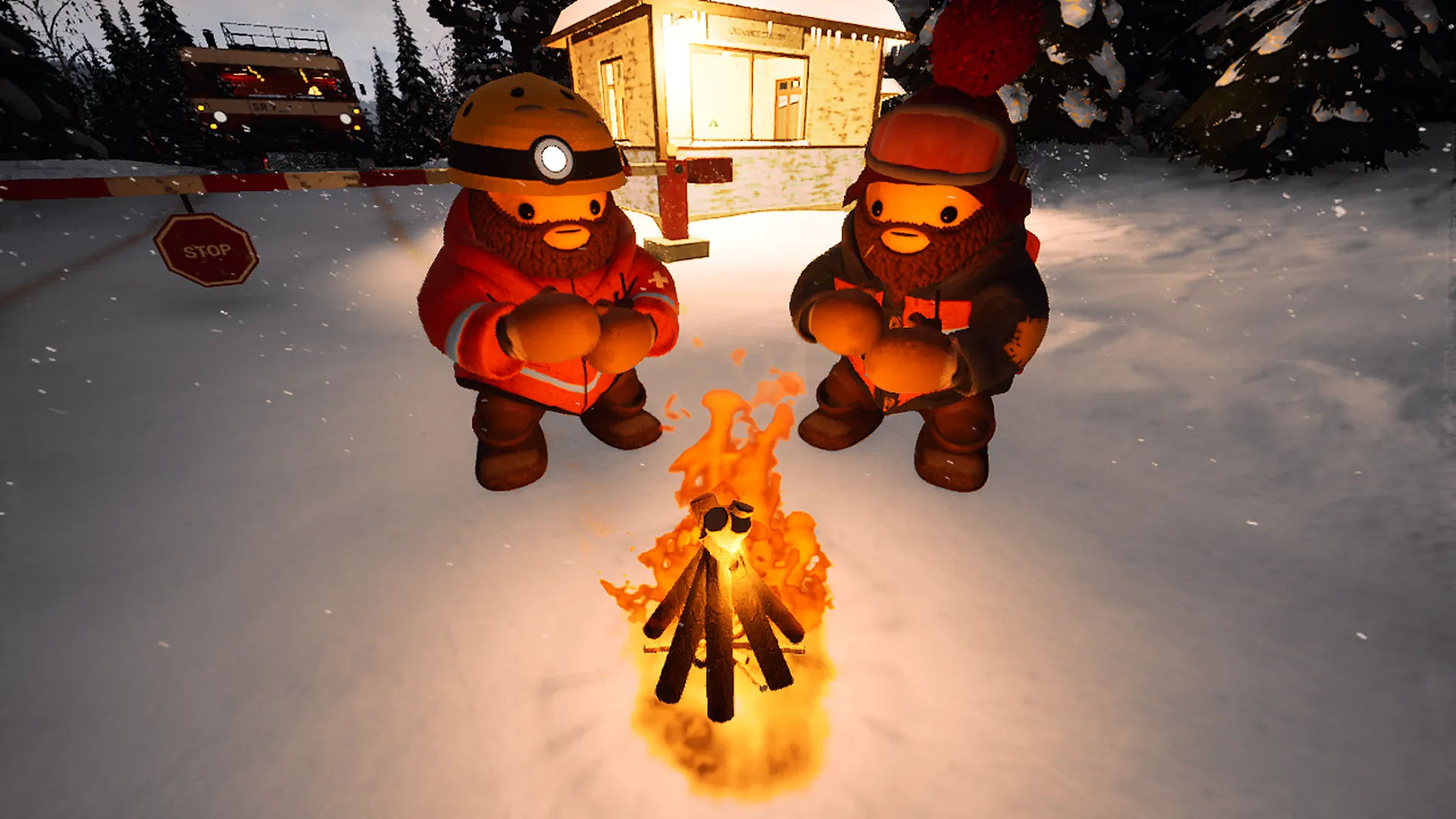Two rescuers warm their hands at a campfire by a checkpoint hut
