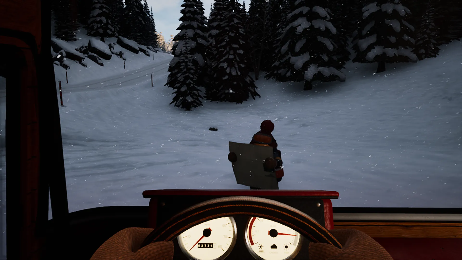 View from the driver seat: a rescuer reads a paper map in front of the van